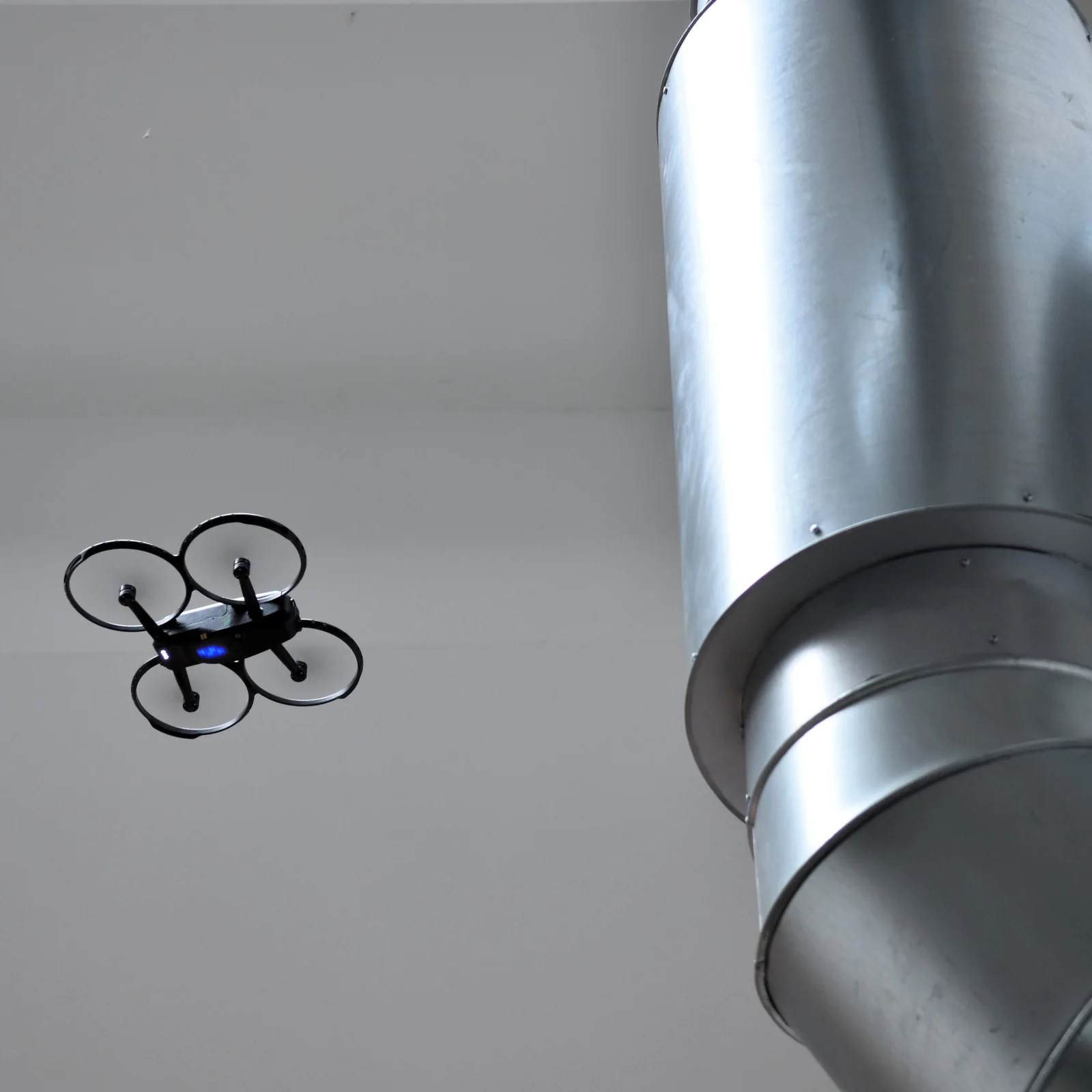 Corax flying near industrial ventilation infrastructure